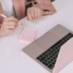 Latino small business owner reviewing questions to ask before hiring a web designer