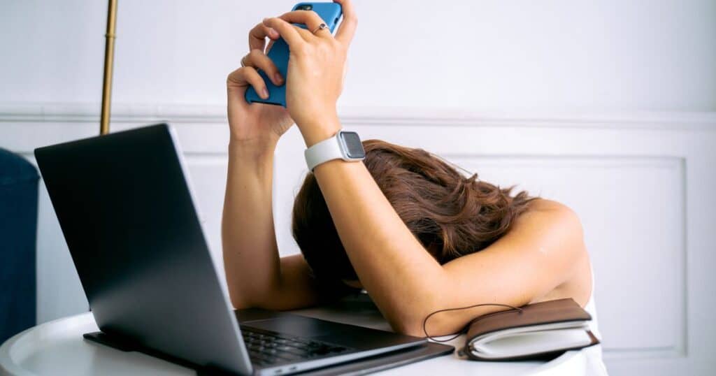 web design bottleneck for small business — frustrated owner waiting on website delivery